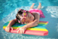 Girl with styrofoam swimming board